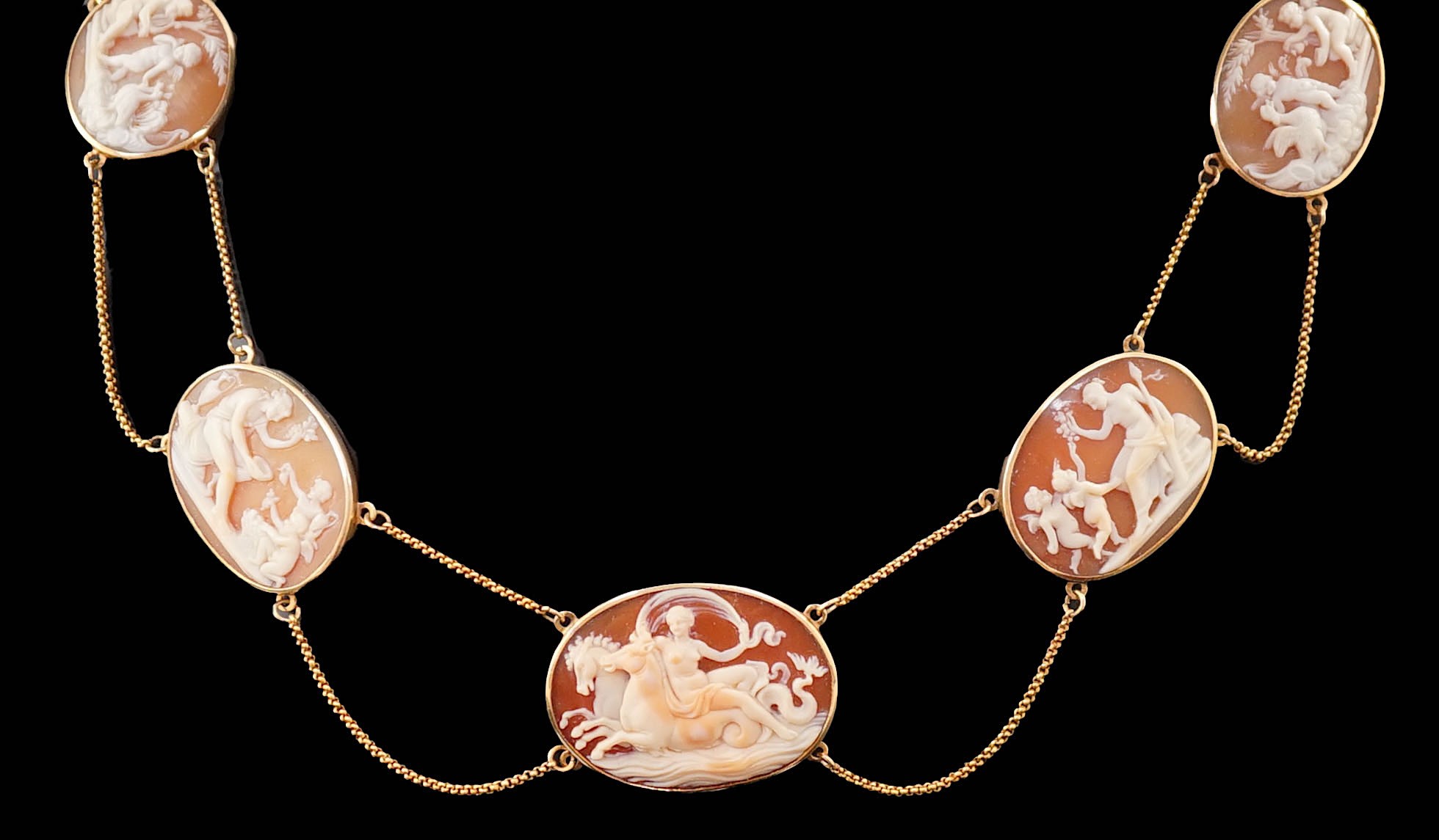 A late Victorian gold and graduated oval cameo shell necklace